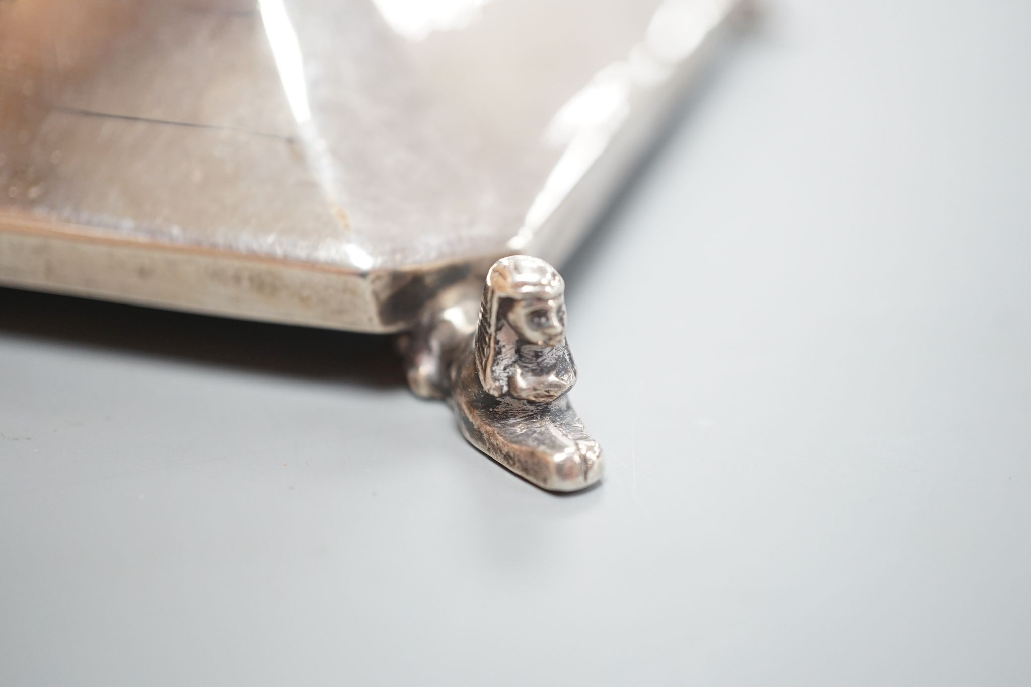 A George V silver mounted inkwell, Birmingham, 1924, with presentation inscription and monogram, 14.2cm.
